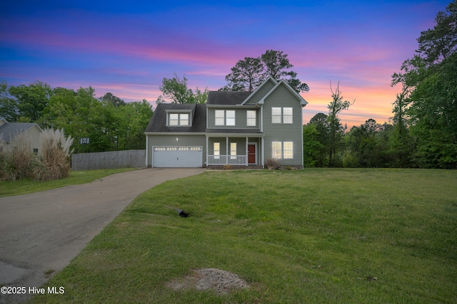 141 Trevor Way, Moyock, NC 27958 - traditional-style house featuring covered porch, concrete driveway, fence, and a front lawn