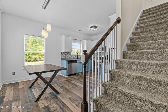 141 Trevor Way, Moyock, NC 27958 - stairs with baseboards, crown molding, and wood finished floors