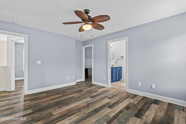 141 Trevor Way, Moyock, NC 27958 - unfurnished bedroom featuring ensuite bath, baseboards, a ceiling fan, and wood finished floors