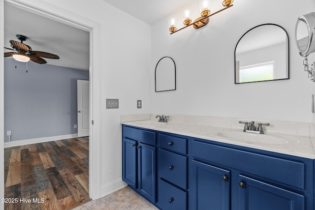 141 Trevor Way, Moyock, NC 27958 - bathroom with double vanity, baseboards, ceiling fan, and a sink