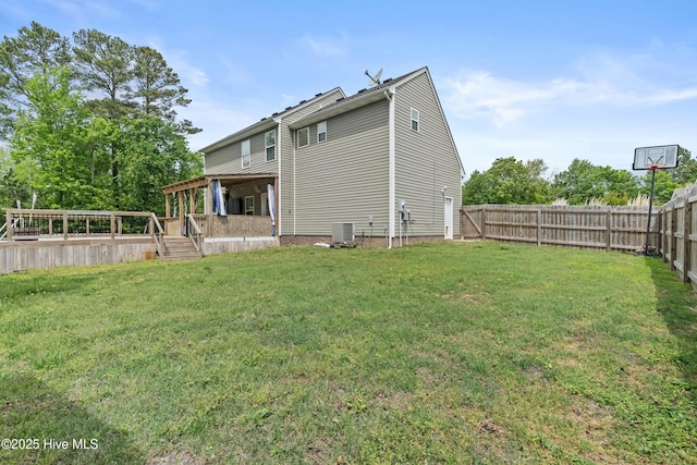 141 Trevor Way, Moyock, NC 27958 - back of property featuring a fenced backyard, a wooden deck, a yard, and central AC unit