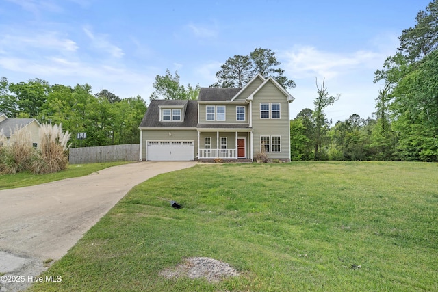 141 Trevor Way, Moyock, NC 27958 - traditional home featuring a porch, fence, a front lawn, and driveway