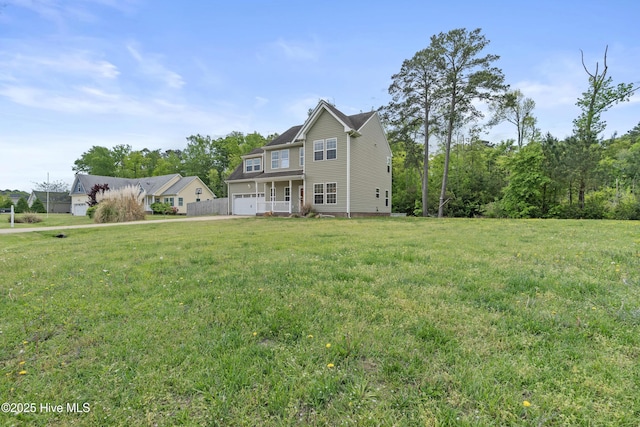141 Trevor Way, Moyock, NC 27958 - rear view of house with a garage and a lawn