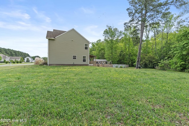 141 Trevor Way, Moyock, NC 27958 - back of house featuring a yard and a deck