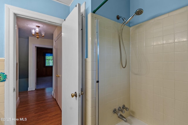 full bathroom with wood finished floors and shower / bathtub combination