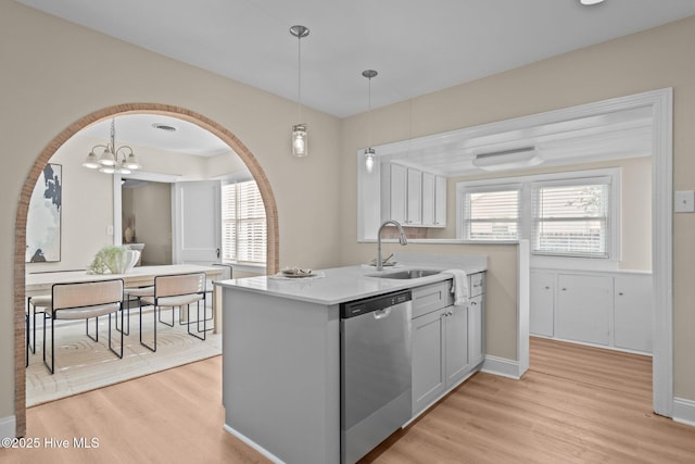 502 Thomas Ave, Wilmington, NC 28405 - kitchen featuring a wealth of natural light, dishwasher, light wood-type flooring, and a sink