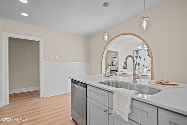 502 Thomas Ave, Wilmington, NC 28405 - kitchen featuring pendant lighting, dishwasher, light countertops, a sink, and light wood finished floors