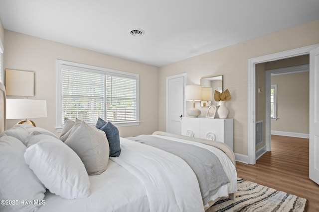 502 Thomas Ave, Wilmington, NC 28405 - bedroom with wood finished floors, baseboards, and visible vents