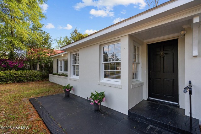502 Thomas Ave, Wilmington, NC 28405 - doorway to property featuring stucco siding