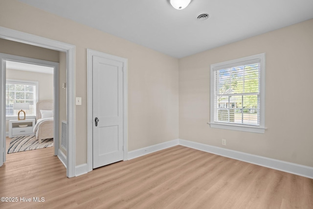 502 Thomas Ave, Wilmington, NC 28405 - unfurnished room with light wood finished floors, baseboards, and visible vents