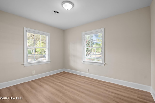 502 Thomas Ave, Wilmington, NC 28405 - spare room featuring light wood finished floors, visible vents, and baseboards