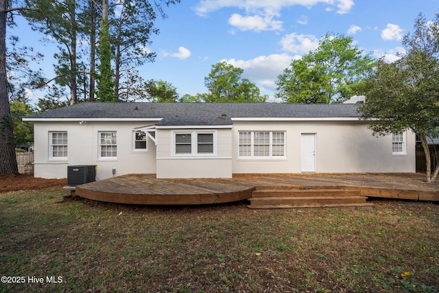 502 Thomas Ave, Wilmington, NC 28405 - rear view of house featuring a deck, a yard, stucco siding, and central AC unit