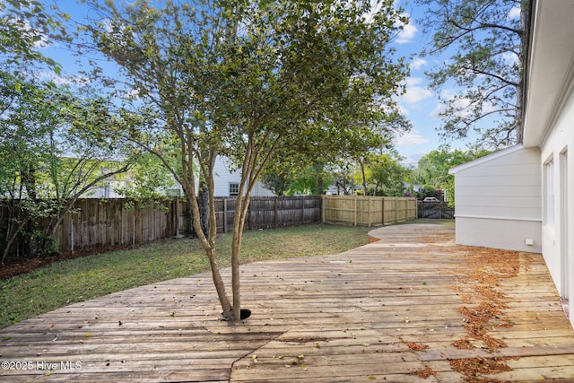 502 Thomas Ave, Wilmington, NC 28405 - deck with a fenced backyard and a lawn