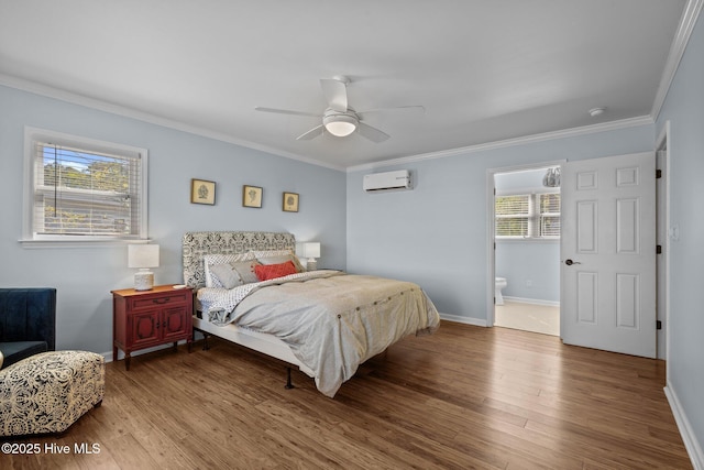 bedroom with baseboards, wood finished floors, a wall mounted AC, and ornamental molding