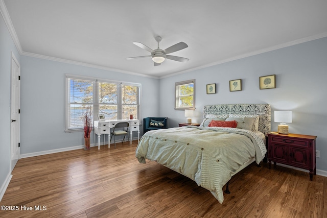 bedroom featuring ceiling fan, baseboards, ornamental molding, and wood finished floors