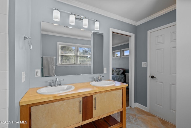 full bath featuring double vanity, crown molding, and a sink