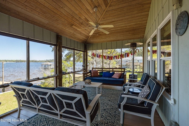 sunroom / solarium featuring outdoor lounge area, a water view, and a ceiling fan