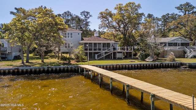 view of dock with a deck with water view and stairs