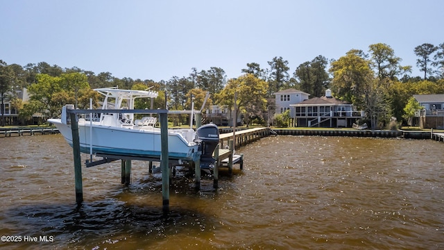 dock area featuring a water view and boat lift