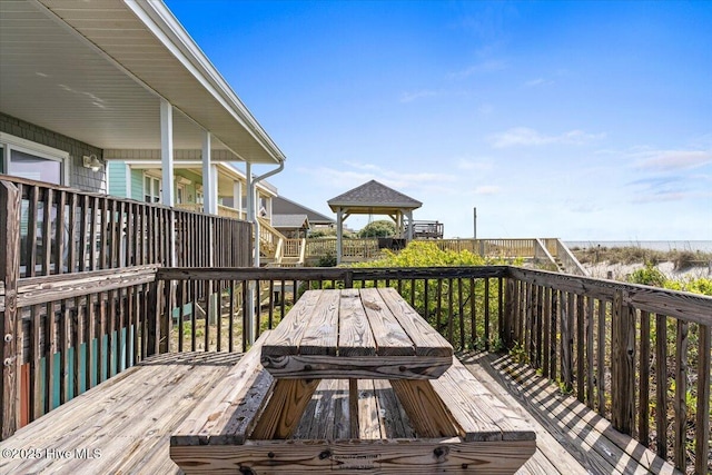 wooden deck with a water view