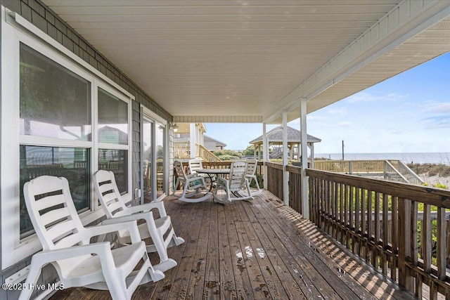 2709 W Beach Dr, Oak Island, NC 28465 - wooden deck with a water view