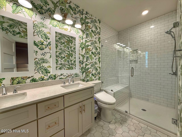 full bathroom featuring wallpapered walls, a sink, and a shower stall
