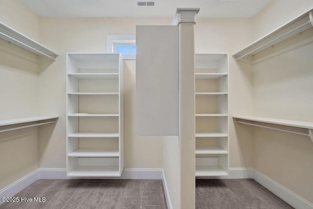 spacious closet with visible vents and carpet