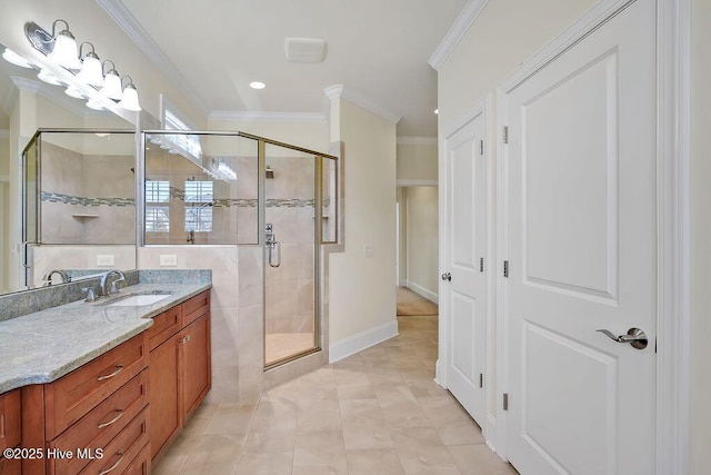 bathroom featuring vanity, tile patterned floors, baseboards, a shower stall, and ornamental molding