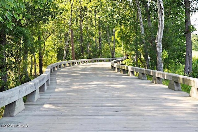 surrounding community featuring a forest view