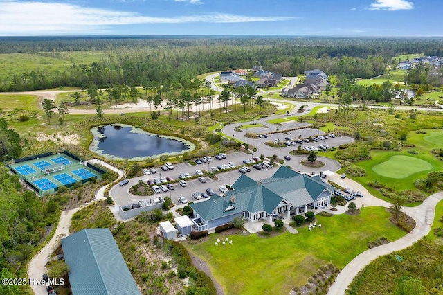aerial view featuring a water view, a view of trees, and view of golf course