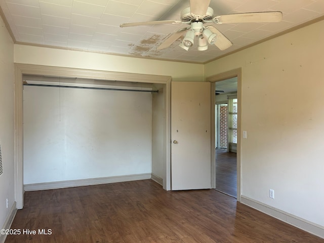 500 Rowan Rd, Clinton, NC 28328 - unfurnished bedroom with a closet, wood finished floors, baseboards, and ceiling fan