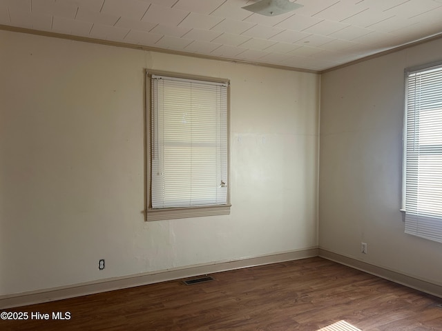 500 Rowan Rd, Clinton, NC 28328 - spare room with ornamental molding, wood finished floors, and baseboards