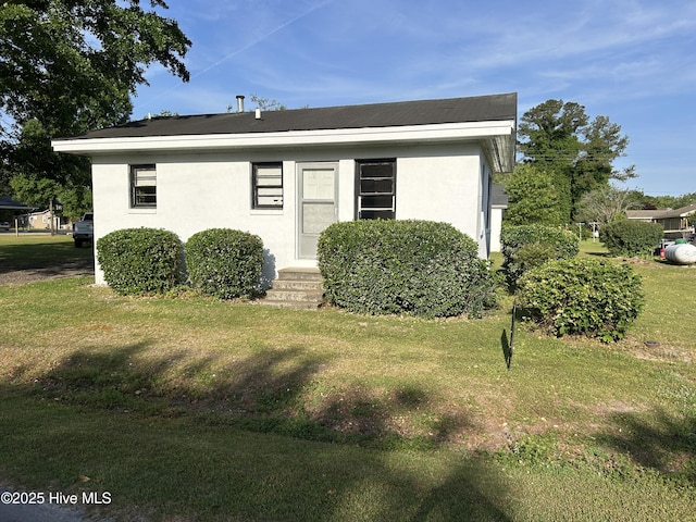 500 Rowan Rd, Clinton, NC 28328 - view of front of property with entry steps, a front lawn, and stucco siding