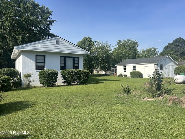 500 Rowan Rd, Clinton, NC 28328 - view of green lawn with an outbuilding