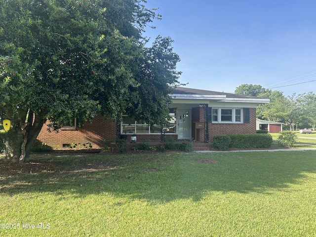 500 Rowan Rd, Clinton, NC 28328 - view of property hidden behind natural elements featuring brick siding and a front lawn