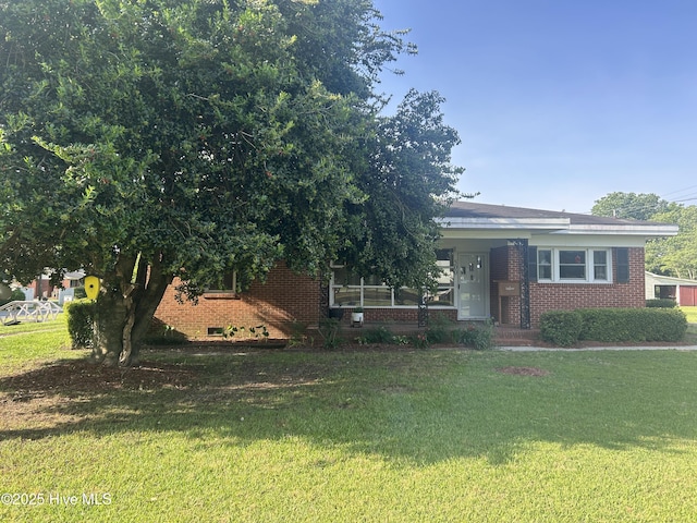 500 Rowan Rd, Clinton, NC 28328 - view of front of home with brick siding and a front lawn