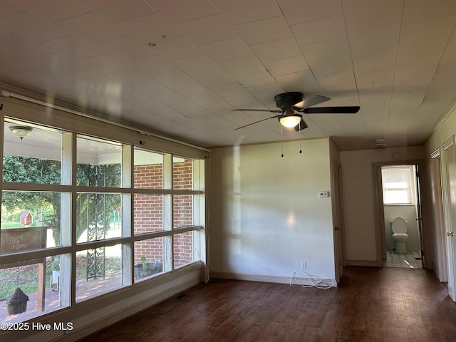 500 Rowan Rd, Clinton, NC 28328 - empty room featuring ceiling fan, wood finished floors, and baseboards