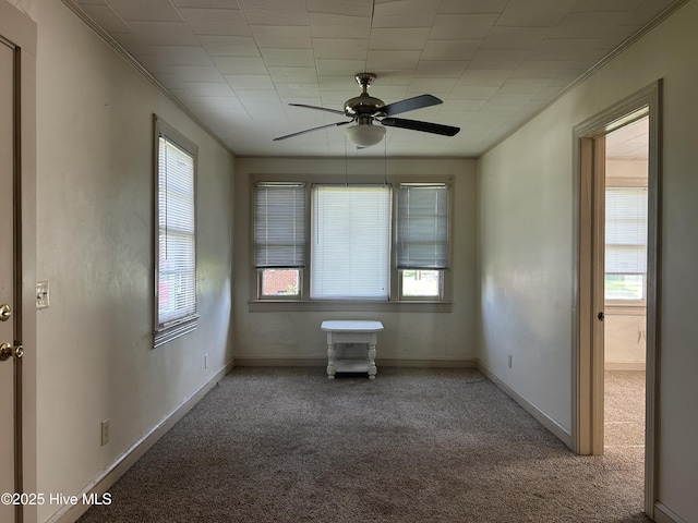 500 Rowan Rd, Clinton, NC 28328 - carpeted empty room with a ceiling fan, ornamental molding, and baseboards