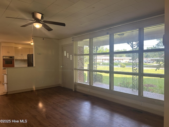 500 Rowan Rd, Clinton, NC 28328 - unfurnished living room with ceiling fan and dark wood-style flooring