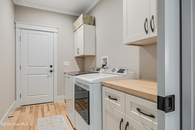392 Blossom Tree Ln SE, Bolivia, NC 28422 - laundry area with cabinet space, light wood-type flooring, washing machine and dryer, ornamental molding, and baseboards