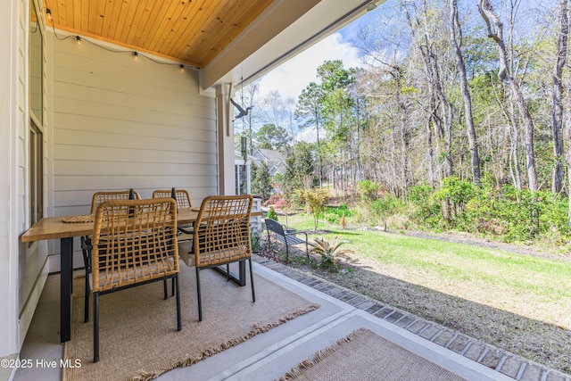 392 Blossom Tree Ln SE, Bolivia, NC 28422 - sunroom with outdoor dining area
