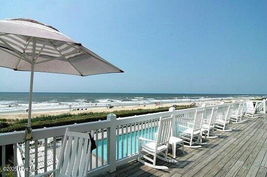 392 Blossom Tree Ln SE, Bolivia, NC 28422 - wooden terrace featuring view of water and beach