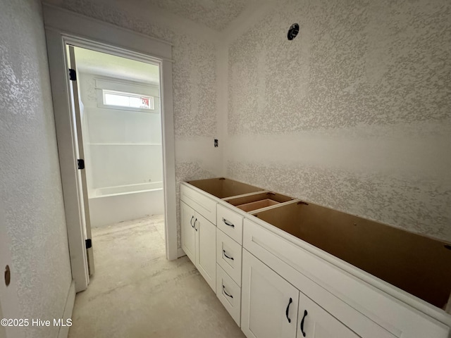 bathroom with concrete flooring