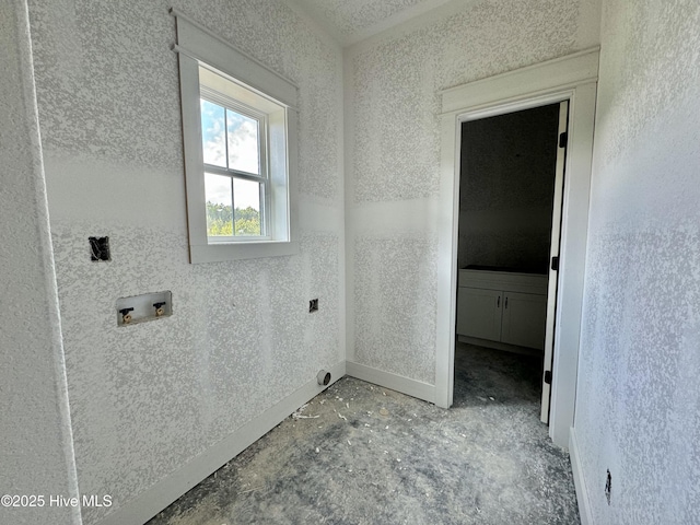 laundry area featuring laundry area, hookup for a washing machine, and baseboards
