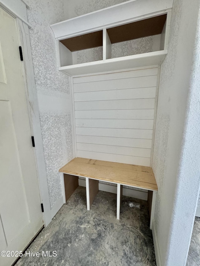 mudroom featuring unfinished concrete floors