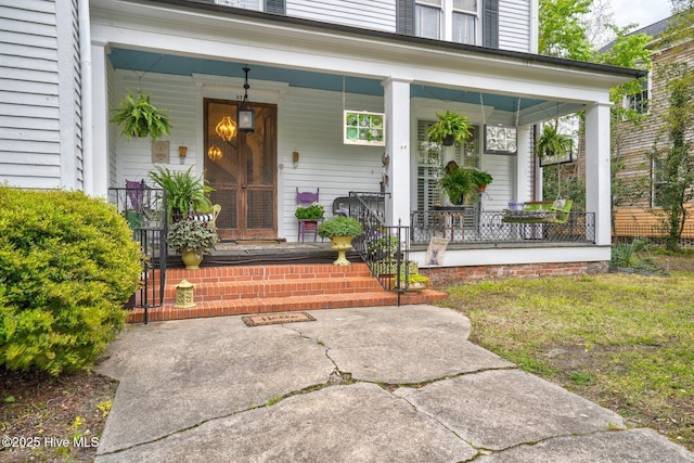 311 E Church St, Tarboro, NC 27886 - view of exterior entry featuring a porch