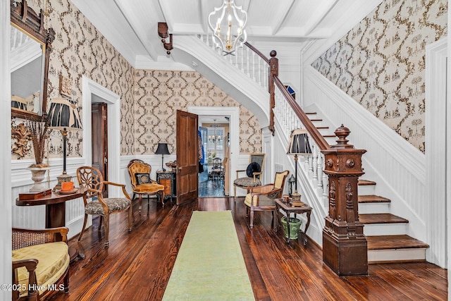 311 E Church St, Tarboro, NC 27886 - entryway with a notable chandelier, wallpapered walls, ornamental molding, stairs, and dark wood-type flooring