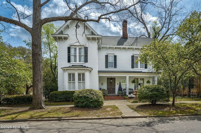 311 E Church St, Tarboro, NC 27886 - italianate house with a chimney and covered porch