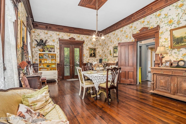 311 E Church St, Tarboro, NC 27886 - dining area with dark wood-type flooring, wallpapered walls, ornamental molding, and french doors