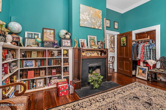 311 E Church St, Tarboro, NC 27886 - sitting room featuring wood finished floors and ornamental molding